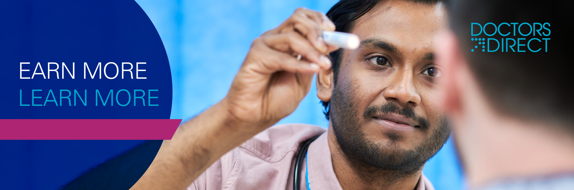 Male doctor holding torch directly facing male patient